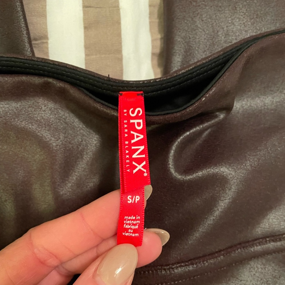 Spanx faux leather leggings in mauve (deep purple tint).